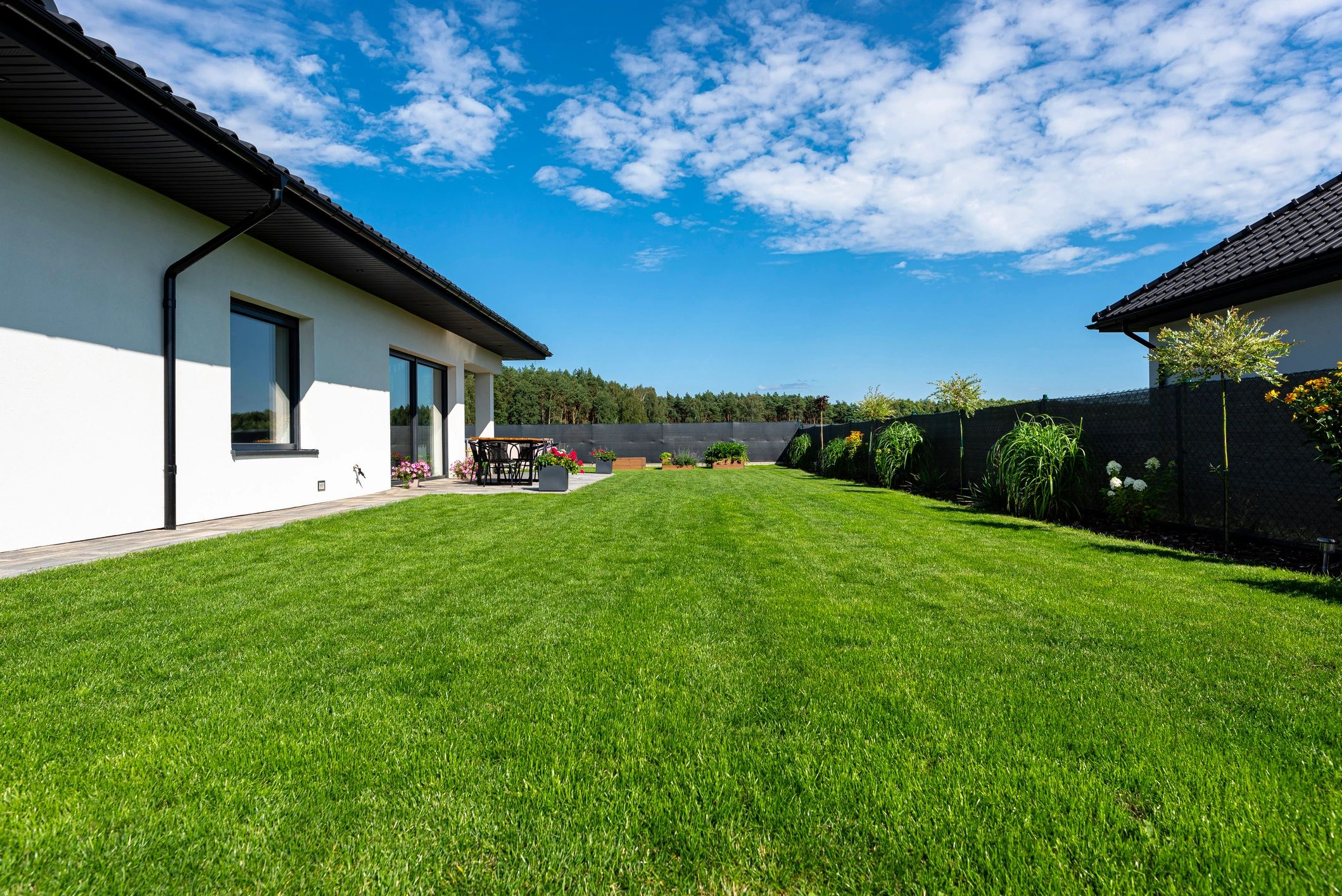 Residential exterior with landscaped lawn